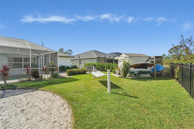 view of yard with a lanai