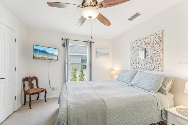 bedroom featuring ceiling fan and light colored carpet