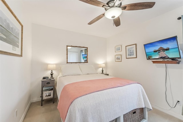 bedroom with ceiling fan and light colored carpet