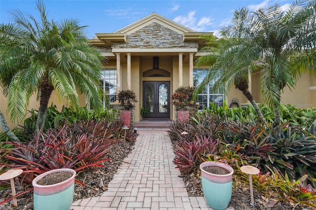 entrance to property featuring french doors