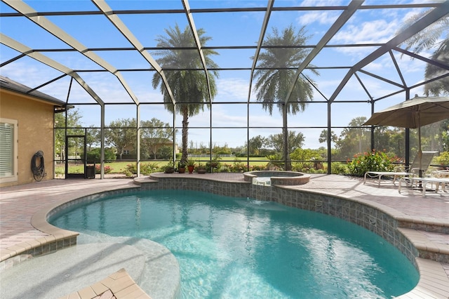 view of pool featuring a patio, a lanai, and an in ground hot tub