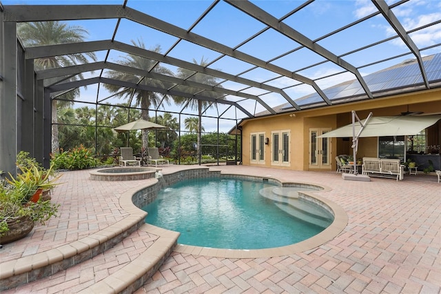 view of swimming pool featuring french doors, an in ground hot tub, a patio area, a lanai, and ceiling fan