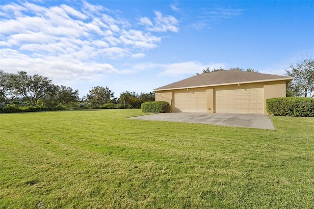 view of yard featuring a garage