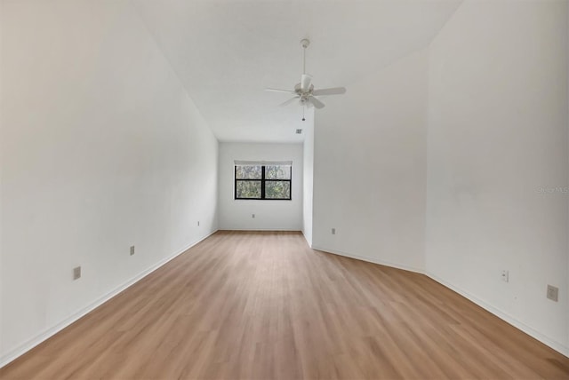 spare room with ceiling fan and light wood-type flooring