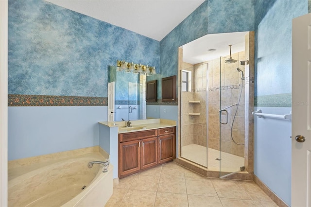 bathroom featuring vanity, tile patterned flooring, and separate shower and tub