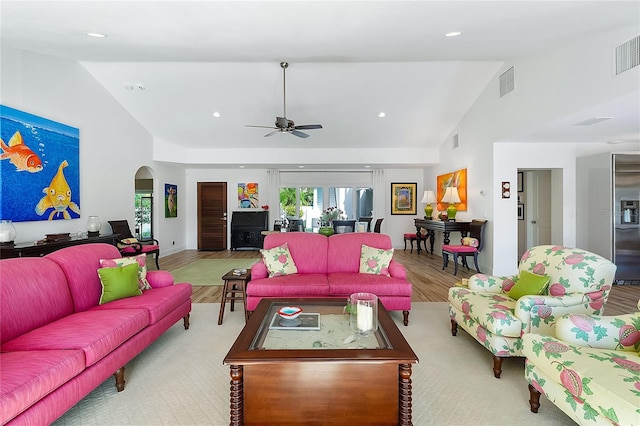 living room with high vaulted ceiling, light hardwood / wood-style flooring, and ceiling fan