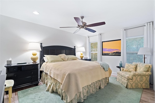 bedroom featuring ceiling fan and hardwood / wood-style floors