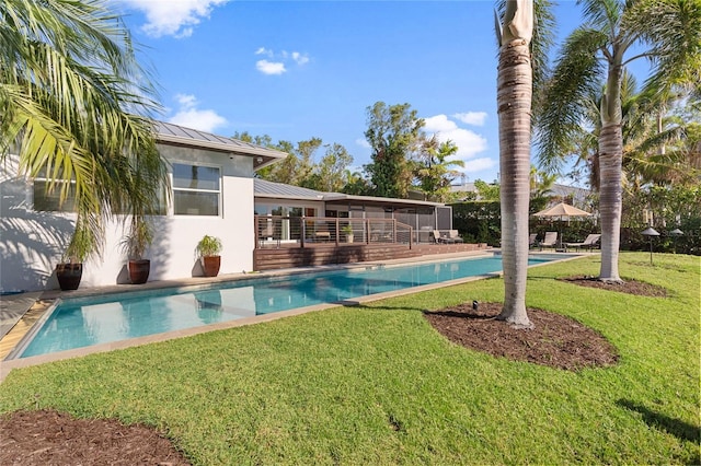 view of swimming pool with a lawn and a patio area