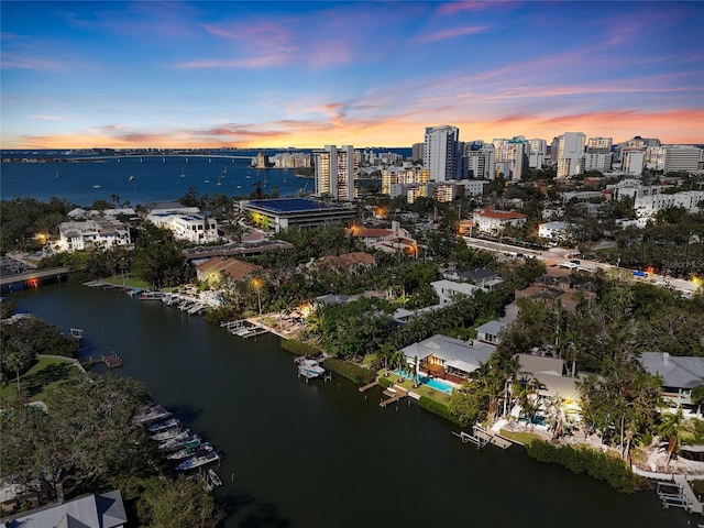 aerial view at dusk with a water view