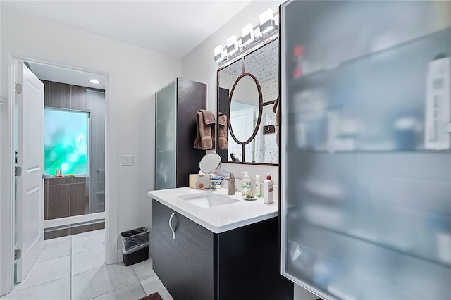 bathroom featuring tile patterned flooring and vanity