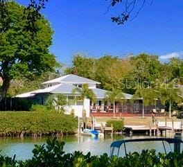 rear view of property with a water view