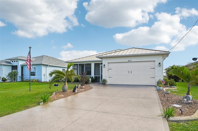 ranch-style home with a front yard, a garage, and a sunroom