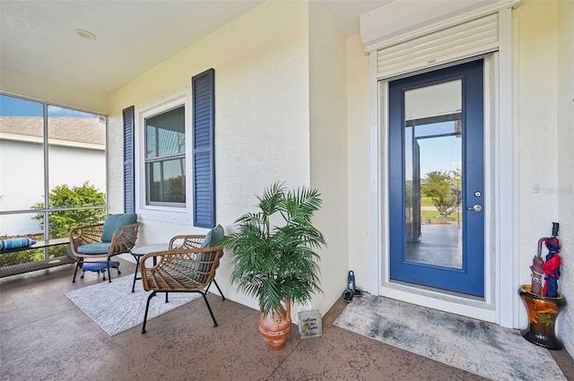 entrance to property featuring a porch