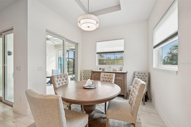 dining space featuring light hardwood / wood-style flooring and ceiling fan