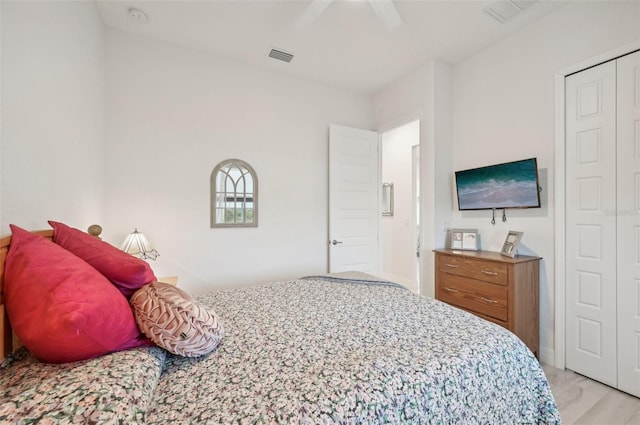 bedroom featuring a closet, ceiling fan, and light hardwood / wood-style floors