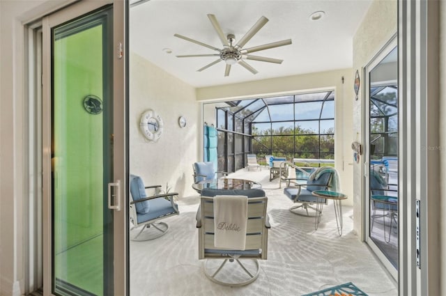 sunroom / solarium featuring ceiling fan