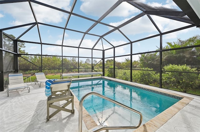 view of swimming pool featuring a lanai and a patio