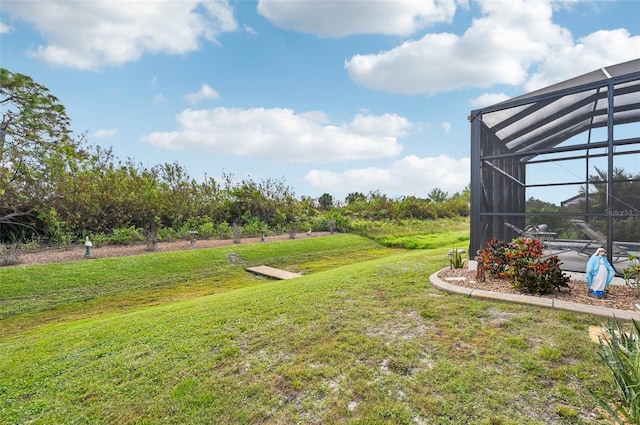 view of yard with a lanai