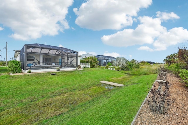 view of yard featuring glass enclosure and a pool