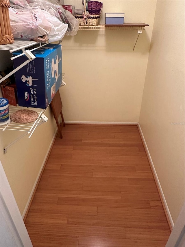 3500 El Conquistador Pkwy Unit 331, Bradenton, FL 34210 - walk in closet featuring wood finished floors