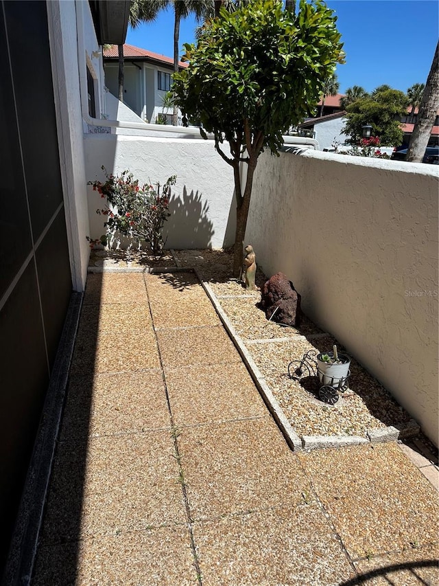 view of patio featuring a balcony