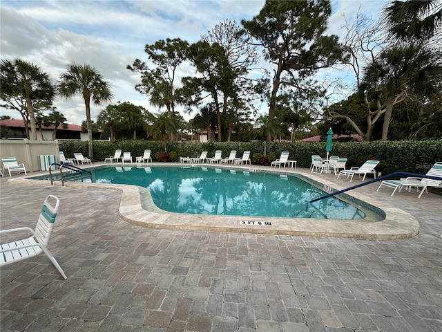 view of swimming pool featuring a patio area