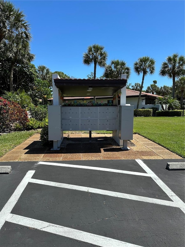 3500 El Conquistador Pkwy Unit 331, Bradenton, FL 34210 - view of community featuring mail area, a yard, and uncovered parking