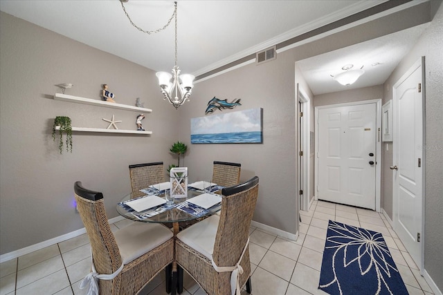 tiled dining space featuring a chandelier