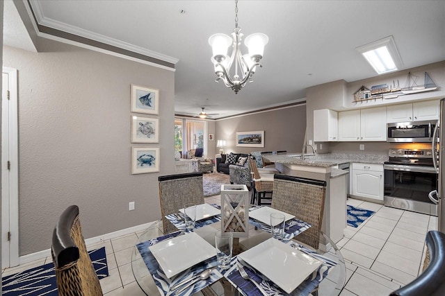 dining space with ceiling fan with notable chandelier, light tile patterned floors, and crown molding