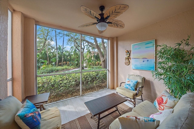 sunroom featuring ceiling fan