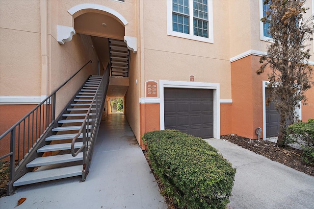 view of exterior entry featuring a garage