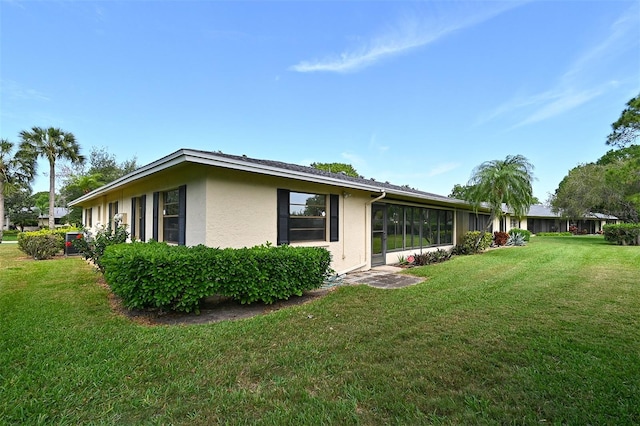 view of home's exterior featuring a lawn