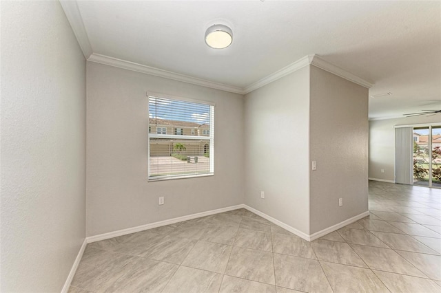 empty room featuring ceiling fan and ornamental molding