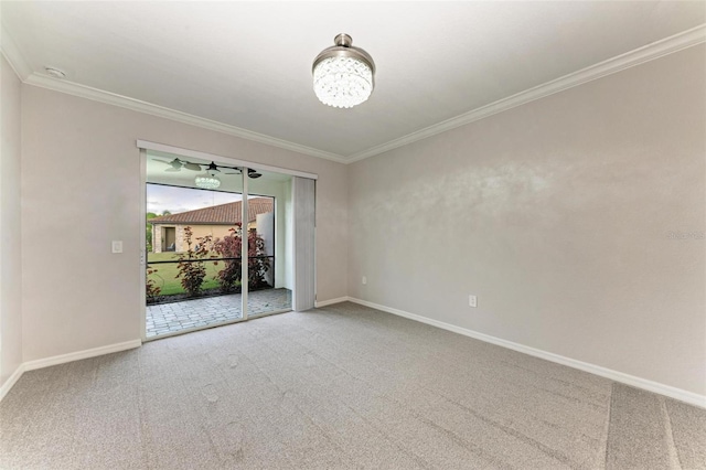 carpeted empty room with crown molding