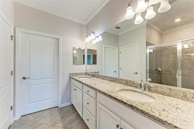 bathroom with a shower with shower door, vanity, tile patterned flooring, and crown molding