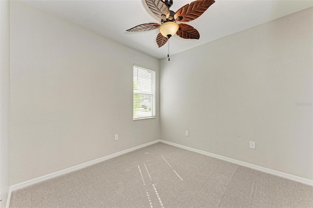 spare room featuring carpet flooring and ceiling fan