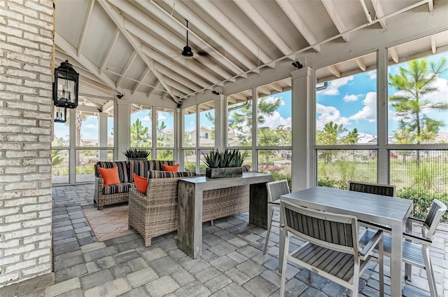 sunroom / solarium with vaulted ceiling