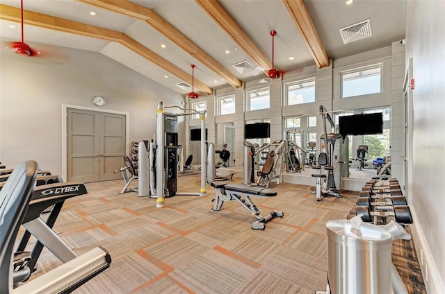 gym featuring high vaulted ceiling and light colored carpet