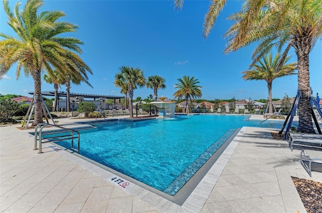 view of pool featuring a patio and pool water feature