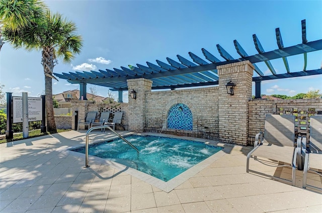 view of swimming pool featuring a hot tub and a pergola