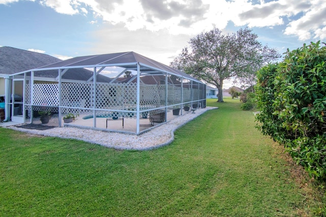 view of yard featuring glass enclosure