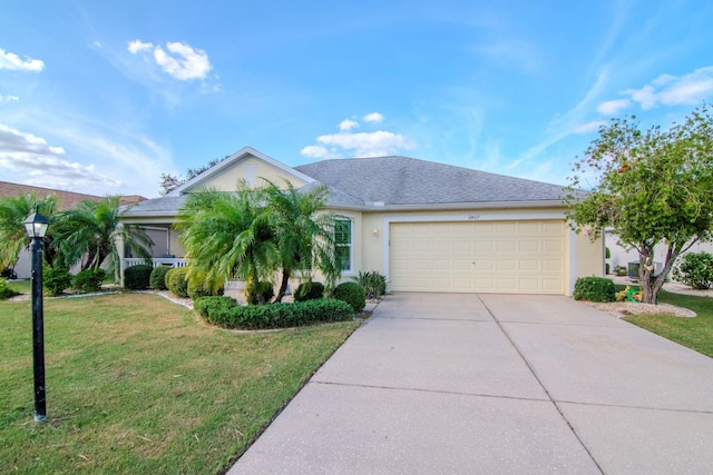 view of front of house featuring a garage and a front lawn