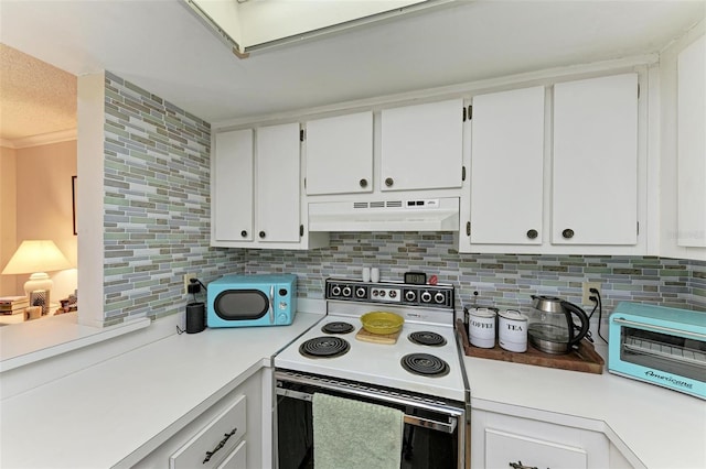 kitchen with decorative backsplash, white cabinetry, and white appliances