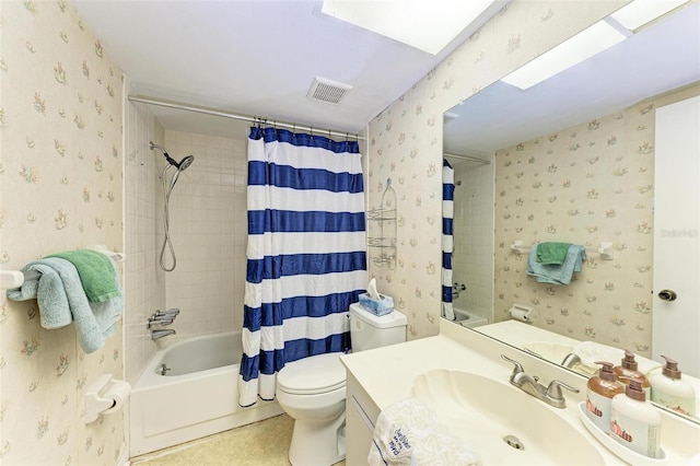 full bathroom with vanity, toilet, and shower / bath combo with shower curtain