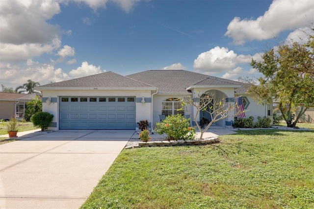 view of front of home featuring a garage and a front yard