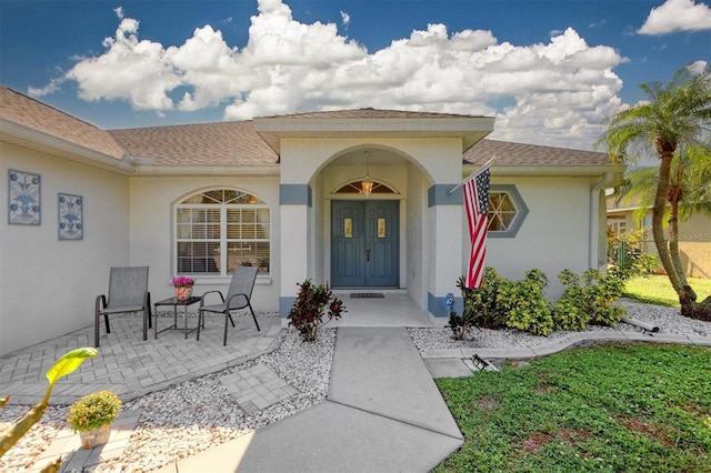 doorway to property with a porch