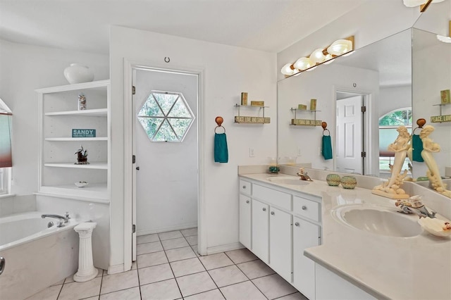 bathroom with tile patterned flooring, vanity, and a bathtub