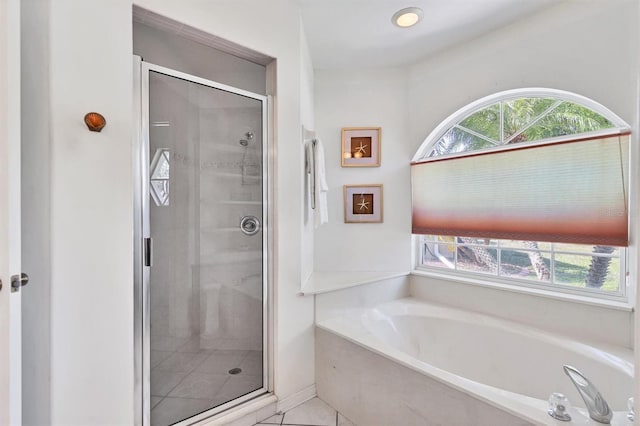 bathroom featuring shower with separate bathtub and tile patterned floors