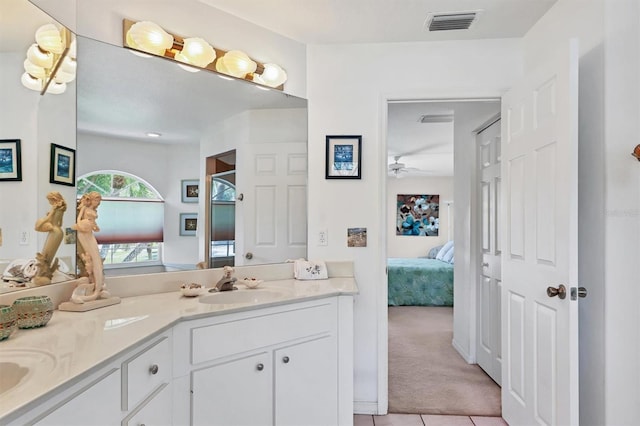 bathroom featuring tile patterned floors, vanity, and ceiling fan