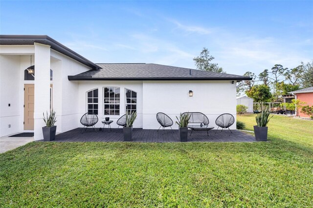 1953 Wheeling Ave, North Port, FL 34288 - view of side of property with a lawn, a patio, and stucco siding